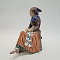 Фигурка сидящей молодой женщины в национальном костюме - View 4